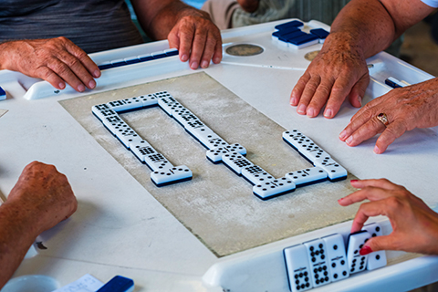 This is a stock photo. An up close image of a game of Dominos.