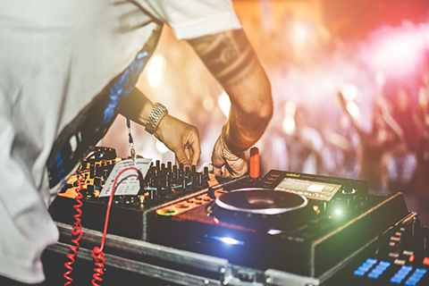 This is a stock photo. An up close image of an entertainment DJ and their turntables.