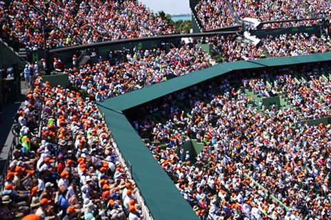 This is a stock photo. A crowded sports stadium.